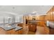 Large kitchen with hardwood floors, wood cabinets, granite countertops, and stainless steel appliances at 1859 Mapmaker Dr, Dacula, GA 30019