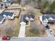 Bird's eye view of property featuring a long driveway, manicured lawn, and mature trees at 4477 James Wade Dr, Snellville, GA 30039