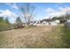 Spacious backyard featuring a well-maintained lawn and partial fence for privacy at 4477 James Wade Dr, Snellville, GA 30039