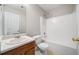 Modest bathroom with single sink and shower-tub combo at 4477 James Wade Dr, Snellville, GA 30039