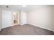 Spacious bedroom with carpet and two doors at 4477 James Wade Dr, Snellville, GA 30039