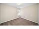 Bedroom with neutral walls and carpet and a window at 4477 James Wade Dr, Snellville, GA 30039