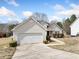 Charming single-Gathering home with a well-maintained lawn and a two-car garage at 4477 James Wade Dr, Snellville, GA 30039