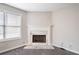 Cozy fireplace with white mantle and marble surround creates a warm ambiance at 4477 James Wade Dr, Snellville, GA 30039