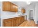 Eat-in kitchen featuring wooden cabinets and white countertops at 4477 James Wade Dr, Snellville, GA 30039