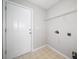 A simple laundry room with white door and wire rack at 4477 James Wade Dr, Snellville, GA 30039