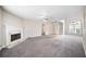 Expansive living room features cozy fireplace and archways to other rooms at 4477 James Wade Dr, Snellville, GA 30039