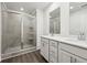 Contemporary bathroom featuring a tiled shower and double vanity with white cabinets at 1705 Trout Lily Pl, Smyrna, GA 30126