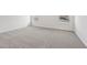 Spacious bedroom featuring neutral carpeting, base trim, and natural light from two windows at 1705 Trout Lily Pl, Smyrna, GA 30126