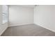 Carpeted bedroom features a window with blinds and neutral walls at 1705 Trout Lily Pl, Smyrna, GA 30126