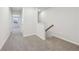 Hallway with neutral carpet and white walls at 1705 Trout Lily Pl, Smyrna, GA 30126