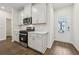 Modern kitchen featuring stainless steel appliances, white cabinetry, and beautiful countertops at 1705 Trout Lily Pl, Smyrna, GA 30126