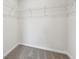 Walk-in closet with neutral carpeting and wire shelving for efficient storage at 1705 Trout Lily Pl, Smyrna, GA 30126