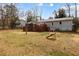 Backyard view of a house with a playset, and large deck that is perfect for entertaining guests at 3521 Stone Ridge Dr, Douglasville, GA 30134