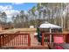 Large backyard with gazebo, deck, mature trees, and play area at 3521 Stone Ridge Dr, Douglasville, GA 30134