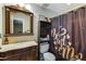 Bathroom with vanity, dark wood shelving, and shower with curtain at 3521 Stone Ridge Dr, Douglasville, GA 30134