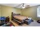 Bedroom with a ceiling fan and unkempt surroundings at 3521 Stone Ridge Dr, Douglasville, GA 30134