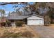 Charming one-story home with a two-car garage, basketball hoop, and partially covered front porch at 3521 Stone Ridge Dr, Douglasville, GA 30134