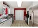 Well-equipped kitchen featuring a stainless steel refrigerator, a window over the sink, and a pantry at 3521 Stone Ridge Dr, Douglasville, GA 30134