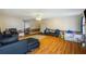 Spacious living room with modern hardwood floors and a ceiling fan at 3521 Stone Ridge Dr, Douglasville, GA 30134