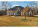 Charming one-story home featuring stone accents, arched windows, and a well-manicured lawn at 429 Telluride Ct, Locust Grove, GA 30248