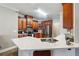 Kitchen featuring stainless steel appliances, wooden cabinetry, and a quartz countertop at 429 Telluride Ct, Locust Grove, GA 30248