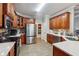 Kitchen with custom wood cabinets, stainless steel appliances, and quartz countertops at 429 Telluride Ct, Locust Grove, GA 30248