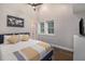 Bright bedroom with a ceiling fan, blue accents, and plenty of natural light at 125 Warren Ne St, Atlanta, GA 30317