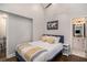 Bright bedroom featuring ensuite bathroom, hardwood flooring, and vaulted ceilings at 125 Warren Ne St, Atlanta, GA 30317