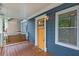Inviting front porch with a swing, and a yellow door at 125 Warren Ne St, Atlanta, GA 30317