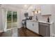 Well-lit kitchen with stainless steel appliances, a modern faucet, and outdoor access at 125 Warren Ne St, Atlanta, GA 30317