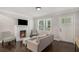 Inviting living room featuring a fireplace, modern furniture, and a bright window at 125 Warren Ne St, Atlanta, GA 30317