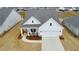 Aerial view of a charming two-story home, showcasing manicured landscaping and a two-car garage at 124 Redford Ln, Canton, GA 30115
