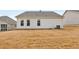 Exterior of home with white siding and a view of the backyard at 124 Redford Ln, Canton, GA 30115