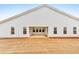 Exterior back of home, showcasing white siding, windows, and a covered patio at 124 Redford Ln, Canton, GA 30115
