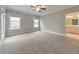 Bright bedroom with soft carpet, natural light, and ensuite bath at 124 Redford Ln, Canton, GA 30115