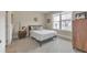 Inviting bedroom featuring a large window and a neutral color palette, perfect for relaxation at 124 Redford Ln, Canton, GA 30115