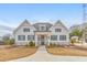 Charming single-story home featuring a beautifully landscaped front yard and a welcoming entrance at 124 Redford Ln, Canton, GA 30115