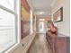 Hallway with wood floors, with natural light, and decorative art at 124 Redford Ln, Canton, GA 30115