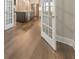 Bright kitchen featuring an island, modern appliances, and hardwood floors at 124 Redford Ln, Canton, GA 30115