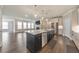 Spacious kitchen with a large island, stainless steel appliances, and open floor plan at 124 Redford Ln, Canton, GA 30115