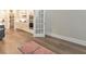 Open floor plan showcasing the kitchen, featuring white cabinets and stainless appliances at 124 Redford Ln, Canton, GA 30115