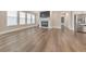 Living area featuring a fireplace, large windows, and hardwood flooring at 124 Redford Ln, Canton, GA 30115