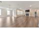 Bright open living room featuring a fireplace, lots of windows, and hardwood flooring at 124 Redford Ln, Canton, GA 30115