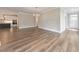 Bright, open-concept living space with hardwood floors, modern lighting, and neutral paint at 124 Redford Ln, Canton, GA 30115