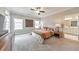 Spacious main bedroom with plush carpet, ceiling fan, and abundant natural light at 124 Redford Ln, Canton, GA 30115