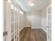 A naturally lit home office with french doors and hardwood floors at 124 Redford Ln, Canton, GA 30115