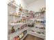 Well-stocked pantry with organized shelving, offering ample storage space for kitchen essentials at 124 Redford Ln, Canton, GA 30115