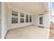 Covered patio with concrete flooring, white trim, recessed lighting, and a view to the yard at 124 Redford Ln, Canton, GA 30115