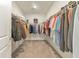 Spacious walk-in closet with ample shelving and hanging space, offering organized storage solutions at 124 Redford Ln, Canton, GA 30115